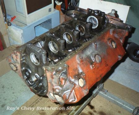 Photo of the bare 409 block on the engine stand