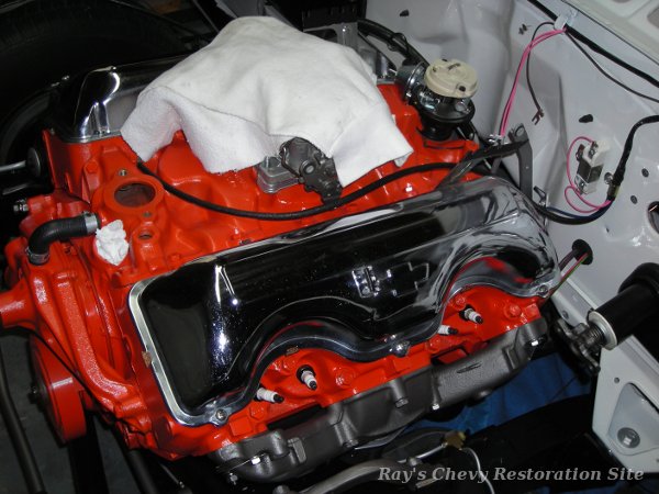 Photo of the exhaust manifolds, distributor, water pump, etc installed