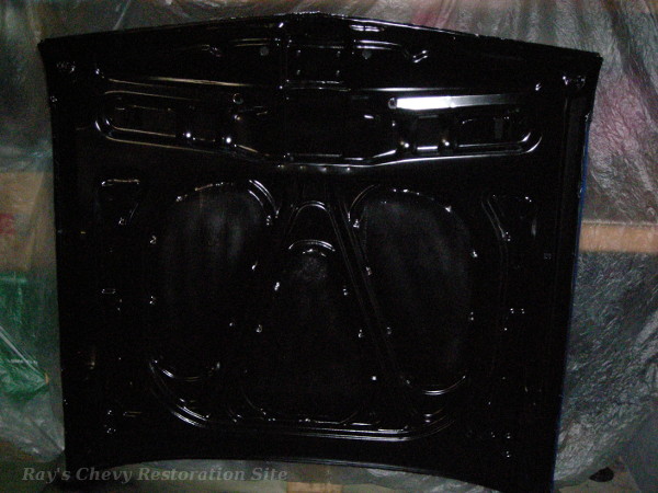 Photo of hte underside of the 63 hood with fresh black paint