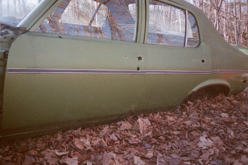 Photo of the green 4-door Nova parts car